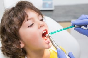 Dentist Examining Little Boy's Teeth