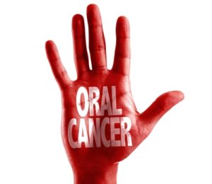 Hand with Oral cancer written on it