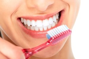 Woman brushing her teeth