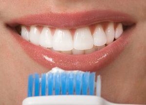 Woman brushing her teeth