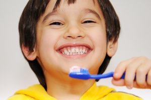 Small boy brushing his teeth